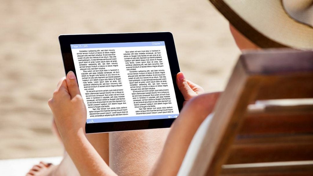 woman on chair reading on beach best e-readers for the beach and the outdoors