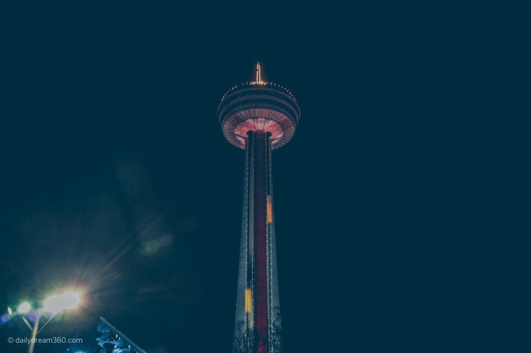 Skylon tower Niagara Falls lit up for New Years at night