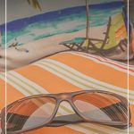 sunglasses on pillow with text Buying The Right Sunglasses: The 10 Best Classic Sunglasses Styles