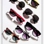 Multiple sunglasses spread out with text Buying The Right Sunglasses: The 10 Best Classic Sunglasses Styles