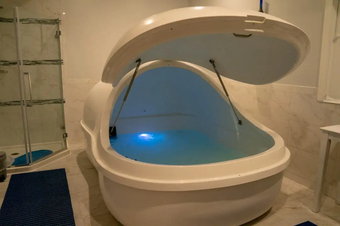 Lit room open salt tank with blue light Discovering the Benefits of Salt Therapy at the Salt Spa of St. Augustine