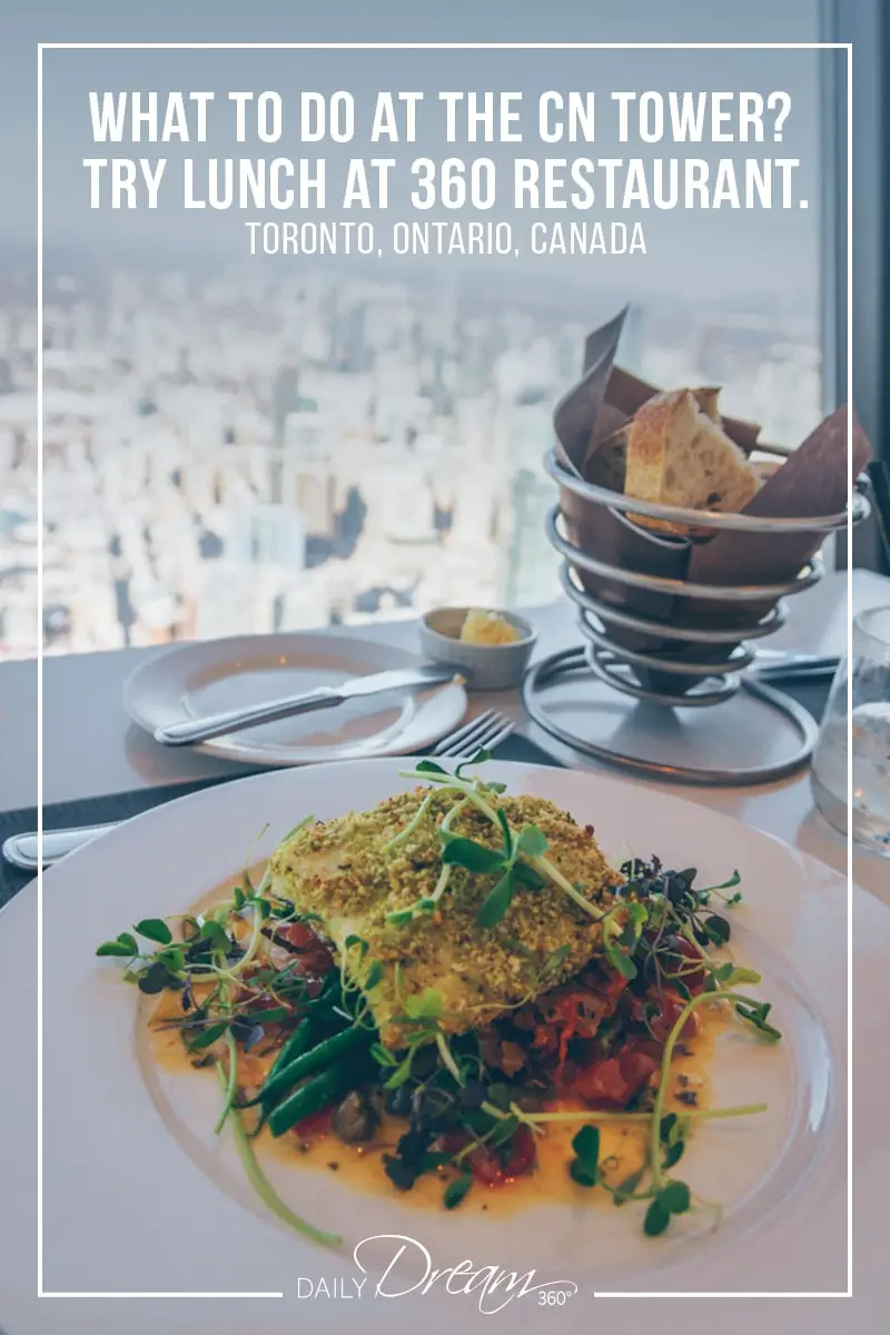 Main course on table overlooking views of Toronto at 360 Restaurant in CN Tower