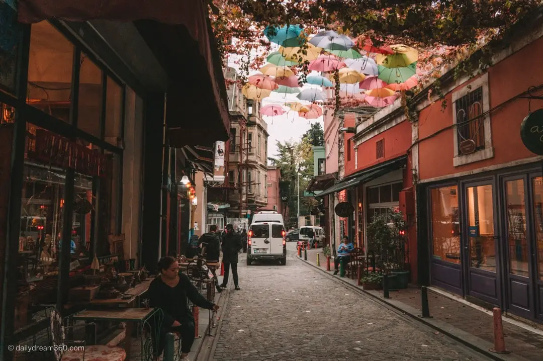Umbrellas hang over street in Balat Neighbourhood Istanbul