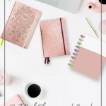 Assorted planners on table desktop with text Best Goal Planners to Help You Achieve Your Dreams