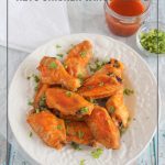 Keto wings on white plate with sauce and napkin and text: Low Carb Wing Sauce Keto Chicken Wings Recipe