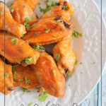 Keto wings on white plate with sauce and napkin and text: Low Carb Wing Sauce Keto Chicken Wings Recipe