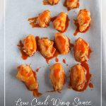 Keto wings on pan with sauce and text: Low Carb Wing Sauce Keto Chicken Wings Recipe