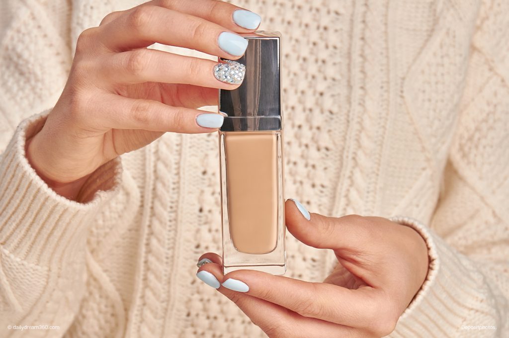 Woman holding foundation bottle