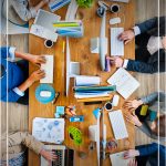 People at desk overview with text How to Start a Successful Blog While Working Full Time