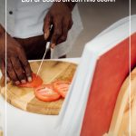man cutting tomatoes in from of cookbook with text How to Detox Sugar with the Best Books on Quitting Sugar (pin image)