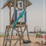 Lifeguard tower with text: Destinations for Summer Road Trips in Ontario