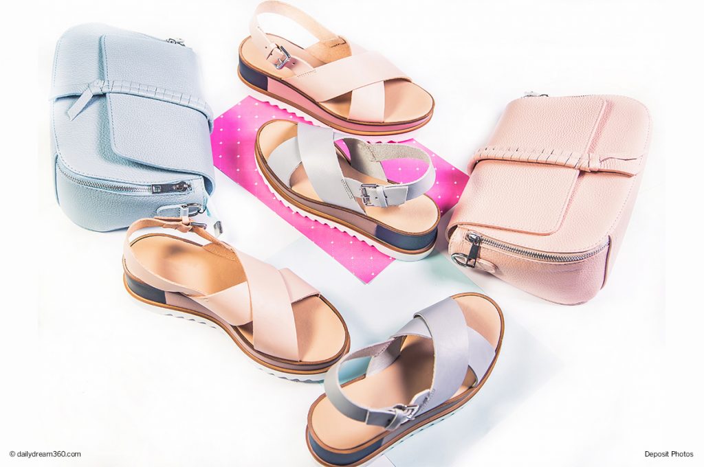 Pastel summer sandals with purses on white background