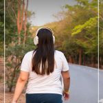 Woman walking on road with pin text Tips on How to Start a Healthy Lifestyle and Stick to It