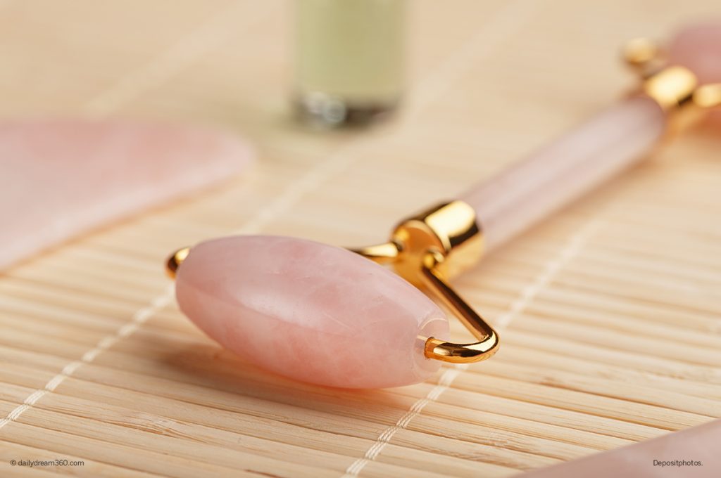 rose face roller on bamboo mat