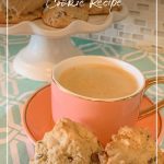 Pink coffee cup with cookies and tray of cookies in background with text Keto Low Carb Sugar Free Peanut Butter Chocolate Chip Cookies