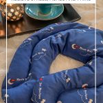 Magic Bag on blanket with candle and cup of tea and text: What is a Magic Bag? How to use it to Relieve Stress, Aches and Pains