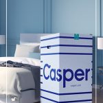 Casper box next to bed with text What You Need to Know About Buying a Mattress in a Box Online (pin image)