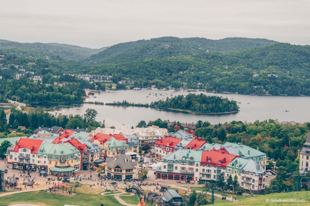 View of Tremblant Village from mountain with lakes and mountains behind