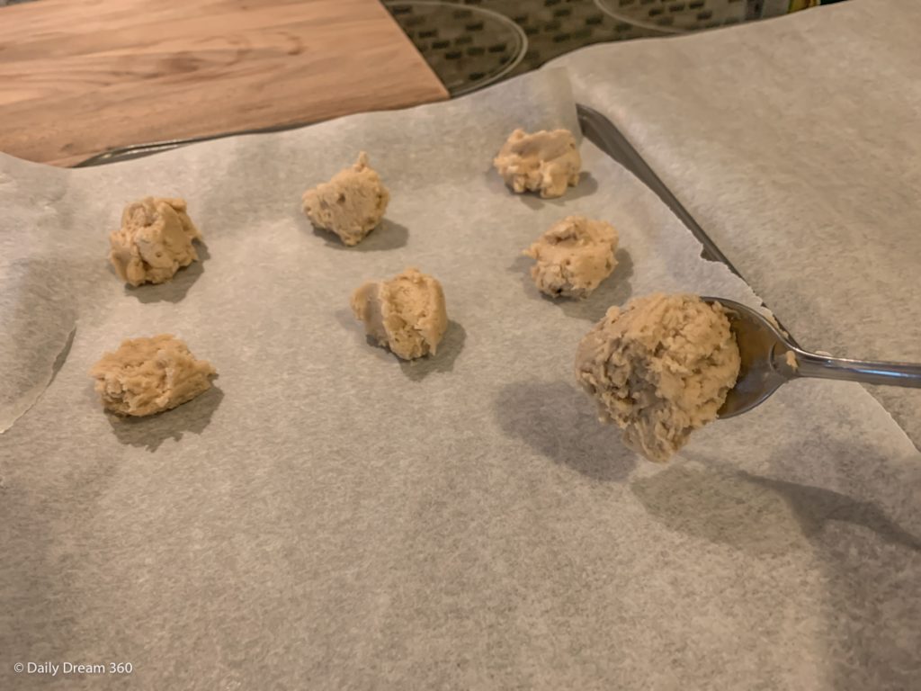 spoon of Carbquik sugar cookie dough on to baking sheet