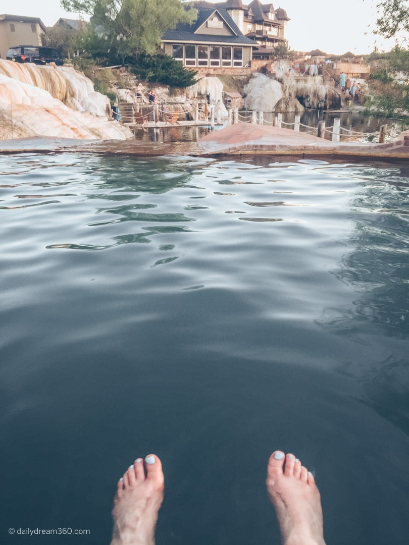 Feet floating in large mineral pool in Pagosa Springs Colorado