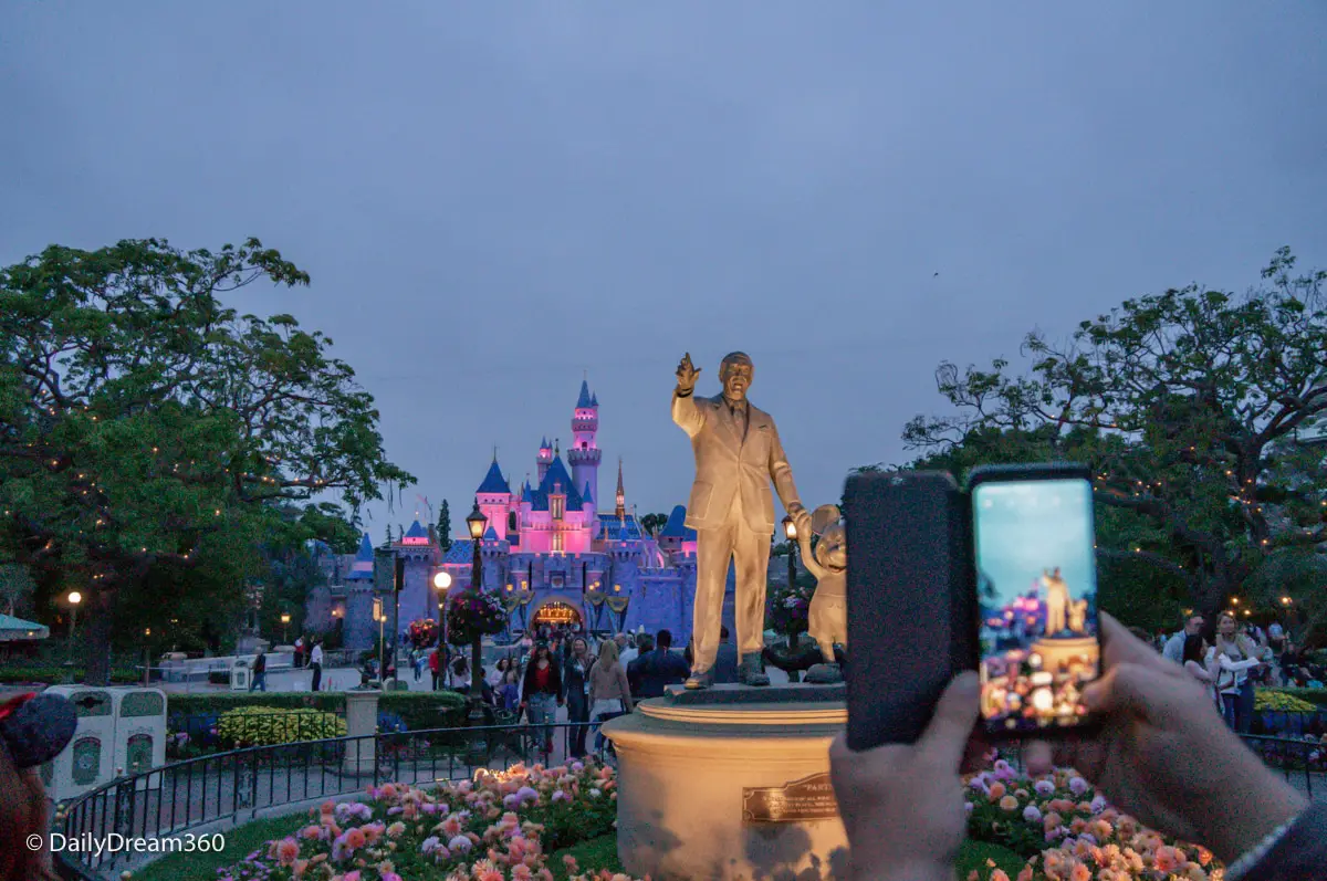 Walt Disney and Mickey Mouse Statues in front of Disneyland Castle