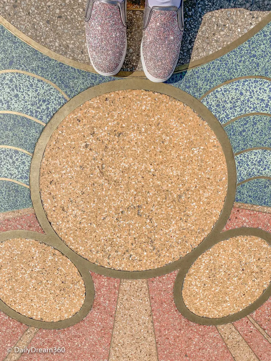 Feet on Mickey Inspired sidewalk at Disneyland California