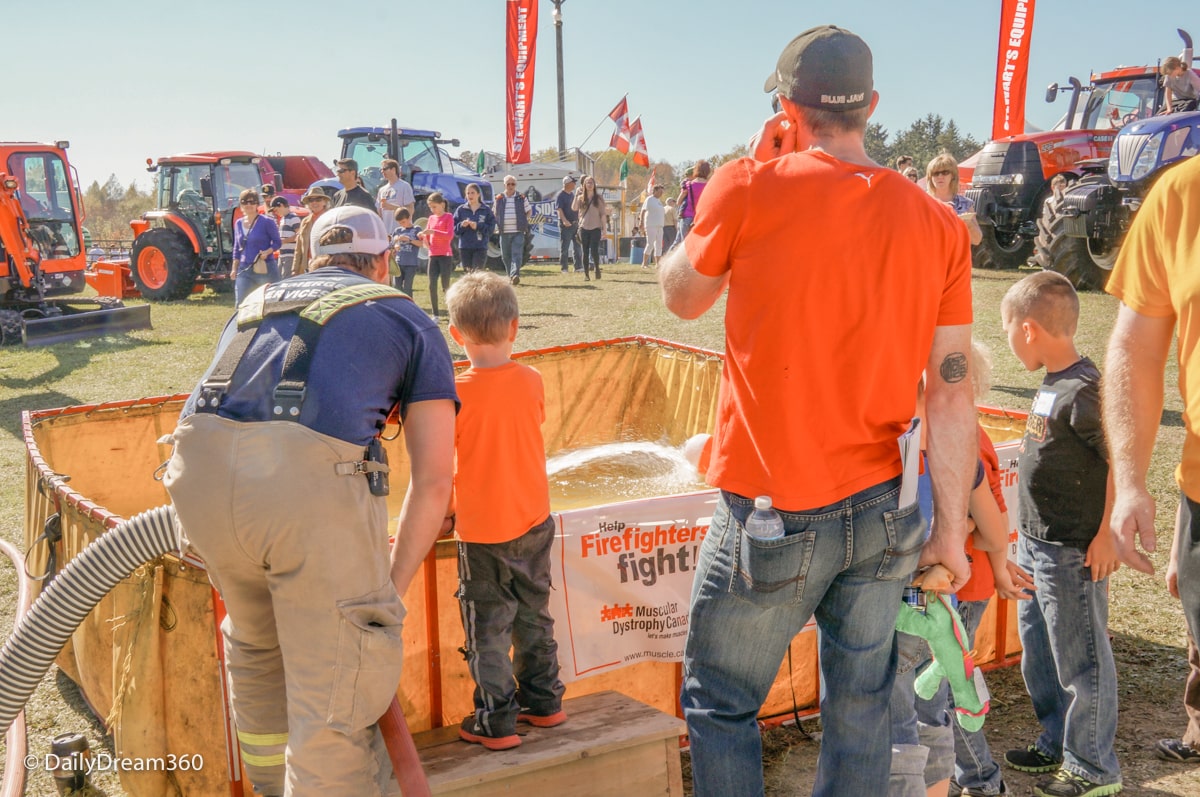 Fire Fighters in Erin Ontario show kids some of their techniques at the fall fair