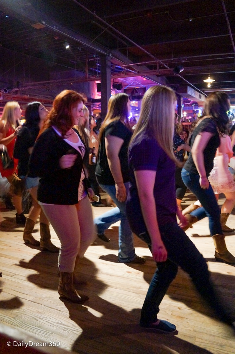 Trying line dancing at Billy Bob's