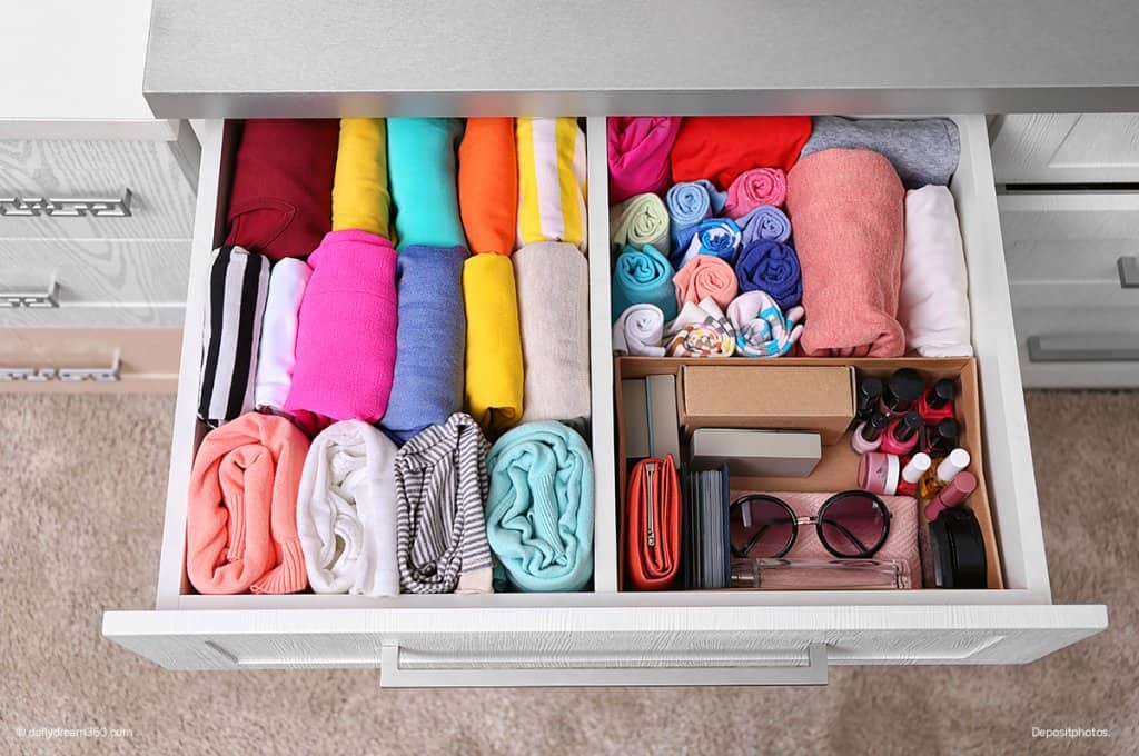 organized bedroom drawer girl folding clothing 7-Day Declutter Challenge: Day 3 How to Declutter Bedrooms