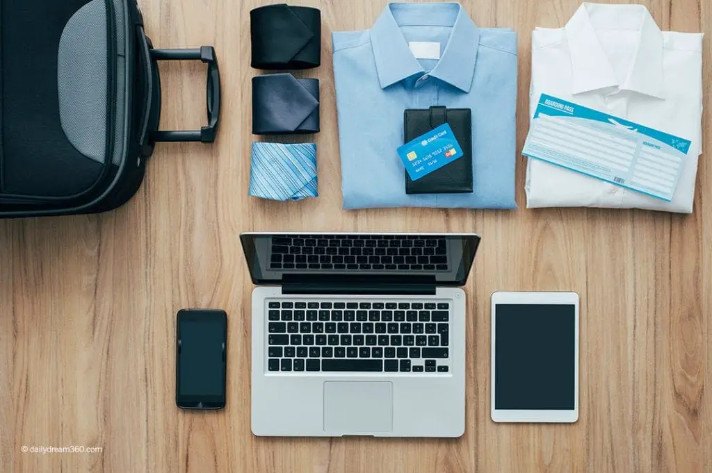 Business traveller items on floor