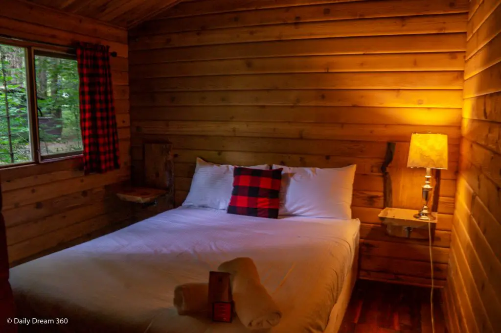 Bed inside bedroom of Muskoka Beer Spa cabin 7