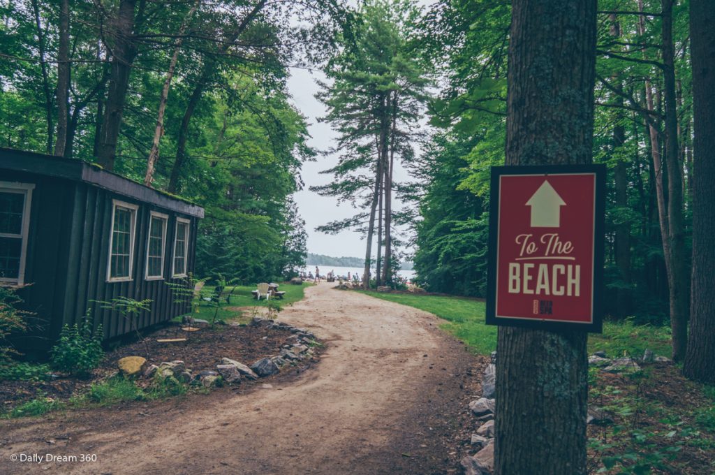 Sign pointing to beach area at Muskoka Beer Spa