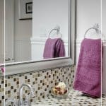 Bathroom counter with text 7-Day Declutter Challenge: Day 4 Cleaning and Organizing Bathrooms