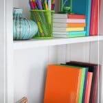 organized colourful bookcase and text 7 Day Declutter Challenge: Day 7 Declutter Your Home Office