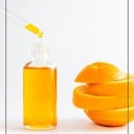 Vitamin C serum Bottle and text: Benefits of Vitamin C in Skincare: Vichy Vitamin C Serum Review