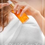 Woman pumping oil into hands with text: Best Body Oil for Glowing Skin Body Oil Benefits