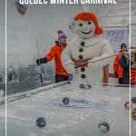 Bonhomme Carnival plays pool on an Ice table during Quebec Winter Carnival