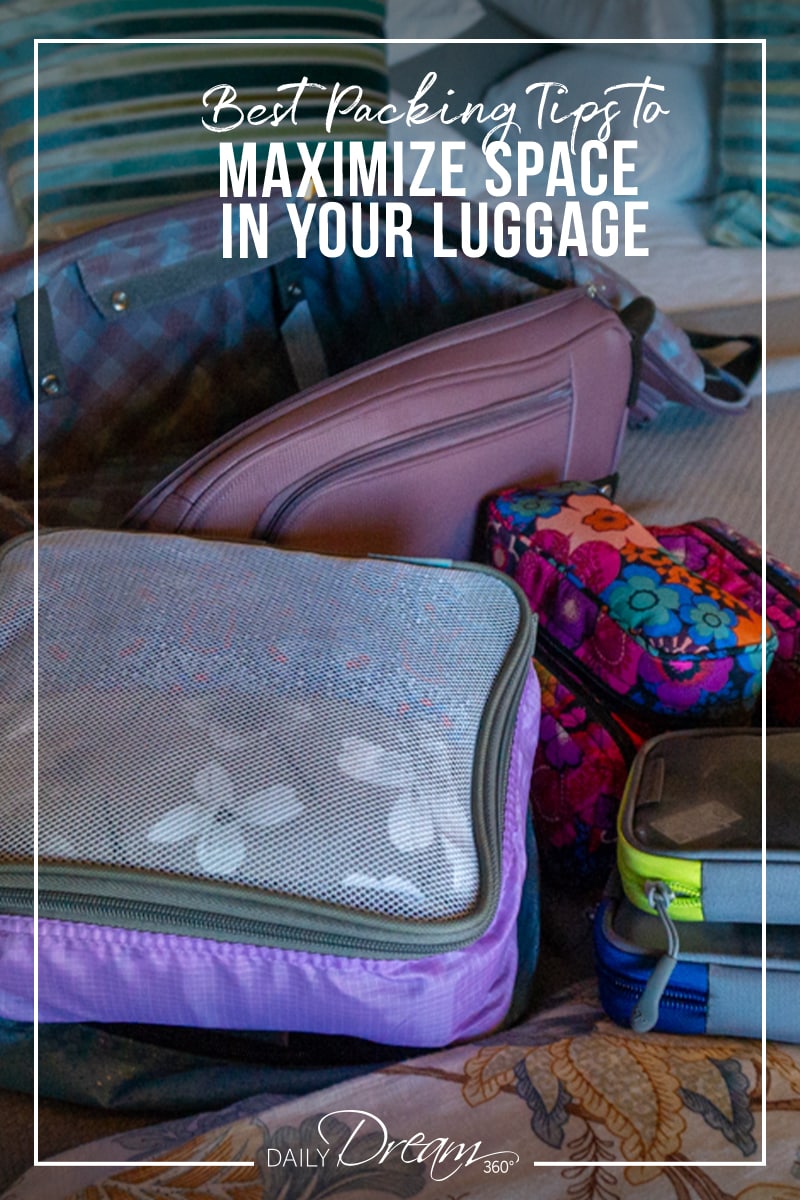 packing cubes and suitcase on bed