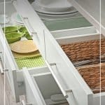 Organized kitchen drawers with text 7 Day Declutter Challenge: Day 6 Declutter Your Kitchen