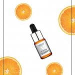 Vichy Vitamin C Serum bottle with orange slices and text: Benefits of Vitamin C in Skincare: Vichy Vitamin C Serum Review