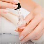 Woman pulling oil out of bottle with text: Best Body Oil for Glowing Skin Body Oil Benefits