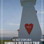 Lighthouse with Welcome to PEI sign next to Confederation Bridge