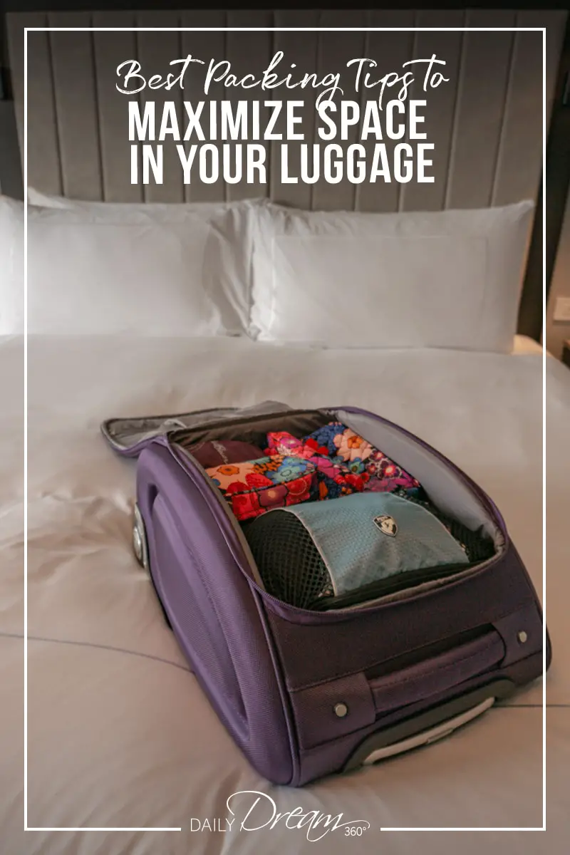 Travelon bag open on hotel bed with packing cubes inside