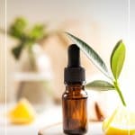 Vitamin C bottle on wood slice and text: Benefits of Vitamin C in Skincare: Vichy Vitamin C Serum Review