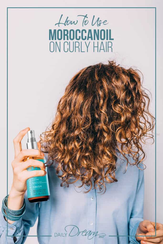 Girl with MoroccanOil products in her hands spraying curly hair