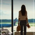 Girl standing at gate window in airport with pin text: Tips for Travelling During Cold and Flu Season