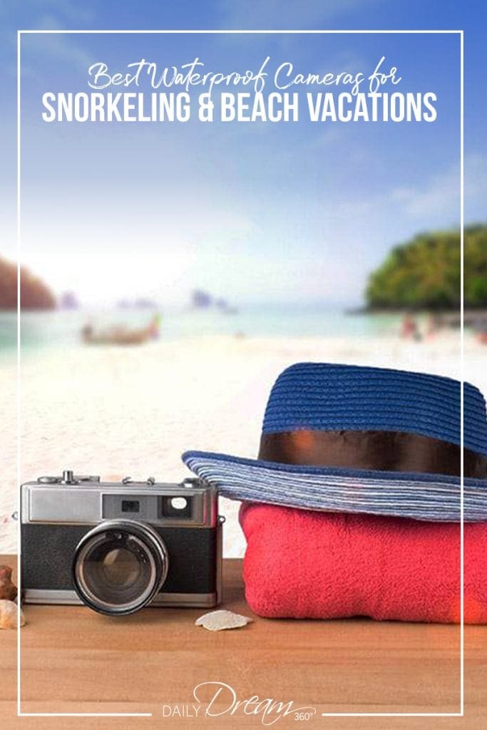 Camera, towel and hat in front of beach