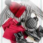 winter clothes laid out on bed