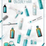 MoroccanOil products laid out on marble background with pin text How to Use MoroccanOil on Curly Hair