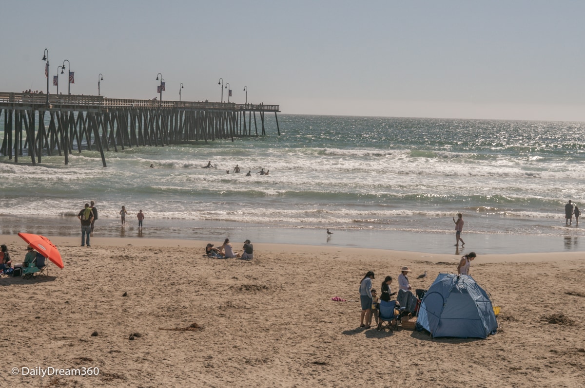 People on Pismo Beach with Pier in the background